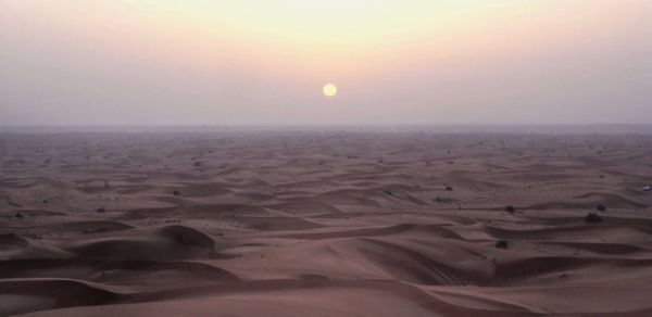Scenic view of landscape at sunset