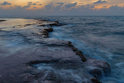 Scenic view of sea against sky during sunset