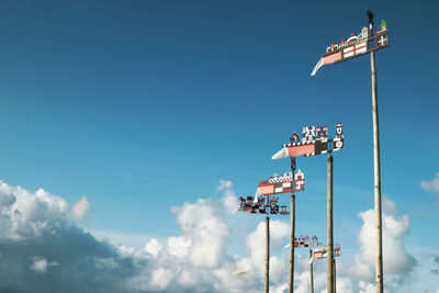 Low angle view of floodlight against blue sky