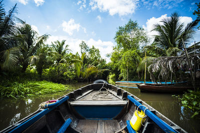 Pov of a boat trip on a river through the vietnamese jungle