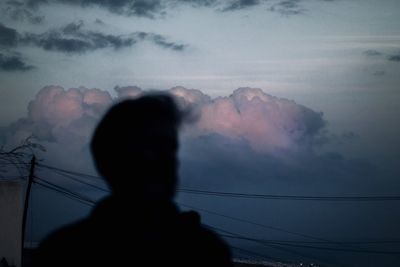 Low angle view of silhouette man against sky at dusk