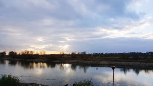 Scenic view of lake against sky during sunset