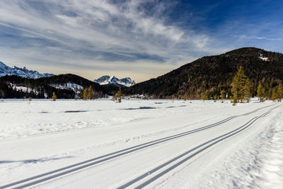 Scenic view of snowcapped mountains against sky during winter