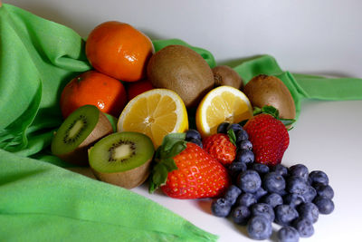 Close-up of fruits in plate on table