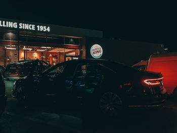 Cars on road in city at night