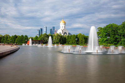 View of temple building against cloudy sky