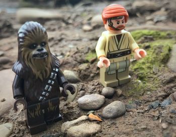 Close-up of boy sitting on rock