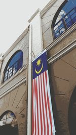 Low angle view of flag against sky