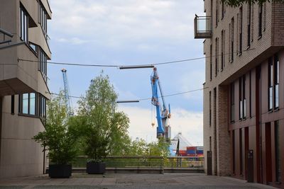 Street amidst buildings against sky