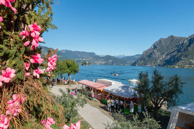 Scenic view of sea and mountains against clear sky