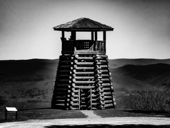 Built structure on beach against sky