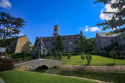 Low angle view of buildings against blue sky