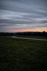 Scenic view of field against sky during sunset