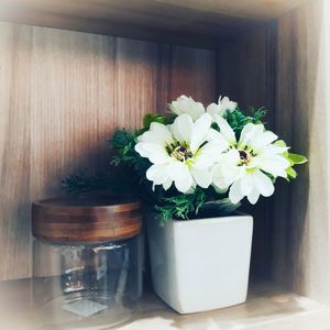 Close-up of white flower vase on table