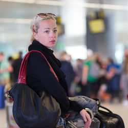 Beautiful woman standing at airport