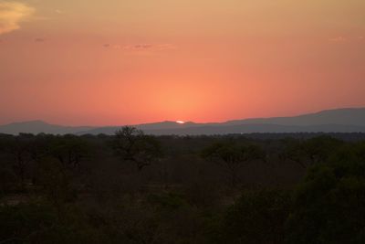 Scenic view of landscape against sky during sunset