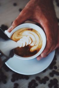 High angle view of coffee cup on table