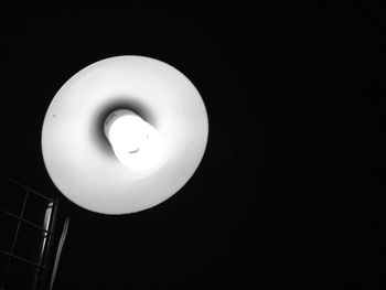 Low angle view of illuminated electric lamp