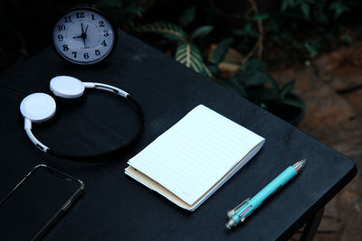 High angle view of clock on table