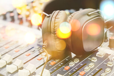 Close-up of headphones on sound mixer