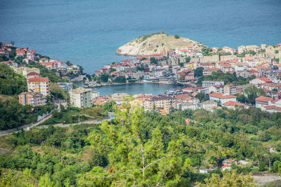 High angle view of townscape by sea