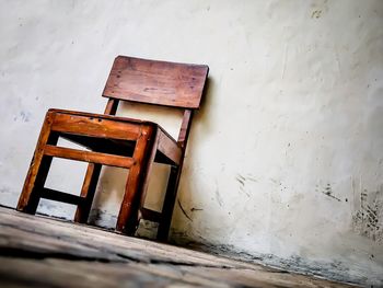 Old wooden table against wall