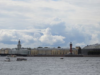 View of ship in sea against cloudy sky