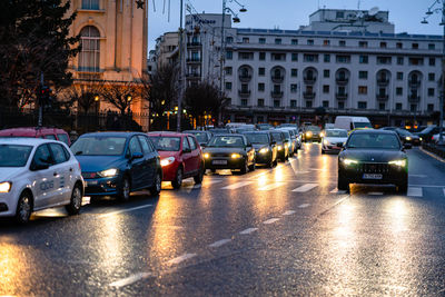 Traffic on city street at dusk