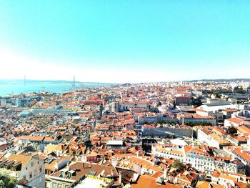 High angle view of cityscape against blue sky