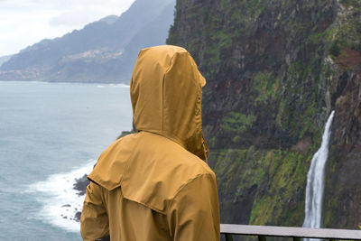 Rear view of man looking at mountains