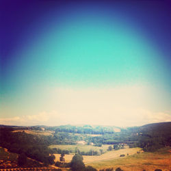 Scenic view of mountains against blue sky