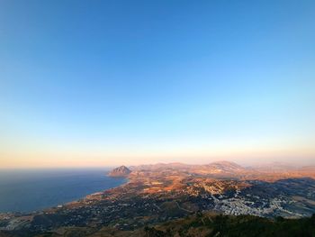 Scenic view of sea against clear sky during sunset