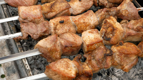 Close-up of meat on barbecue grill