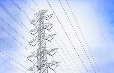 Low angle view of electricity pylon against sky