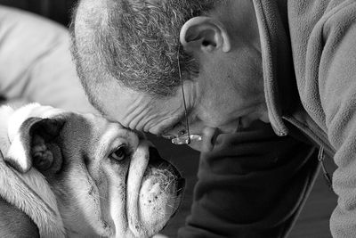Close-up portrait of dog with man
