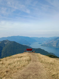 The big red bench placed on the mountain in a panoramic position