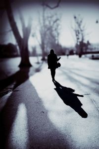 Woman walking on road