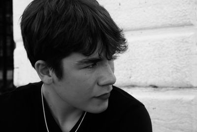 Close-up portrait of young man looking away