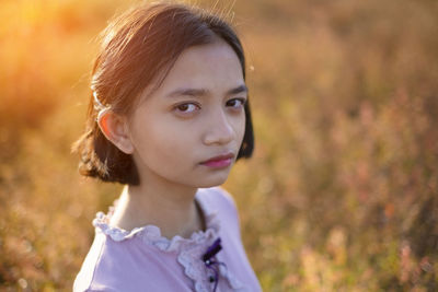 Portrait of girl on field