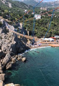 High angle view of trees by sea