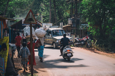 People riding bicycle on road