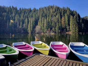 Boats moored in lake