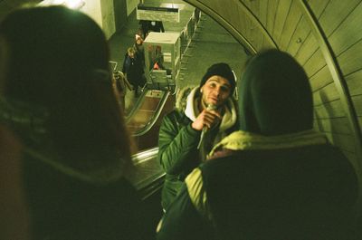 Young woman using mobile phone in train