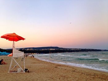 Scenic view of beach against clear sky