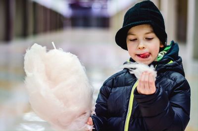 Cute girl eating cotton candy