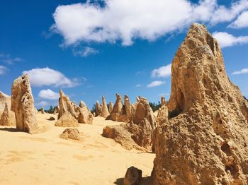 Panoramic view of rock formations against sky