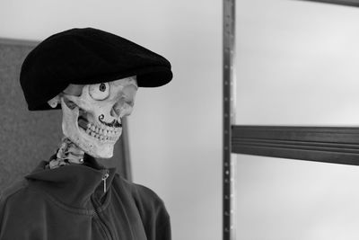 Close-up of human skeleton with flat cap
