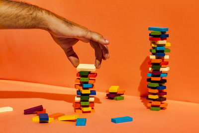 Low section of person playing with toy against wall