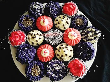 Top view of variety of cupcakes on plate