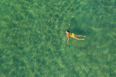 High angle view of a girl swimming in sea, koh rong cambodia